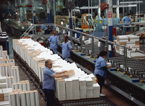 People working on the floor of an industrial plant